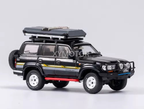 Black Toyota Land Cruiser LC80 diecast SUV model with roof rack and side decals.