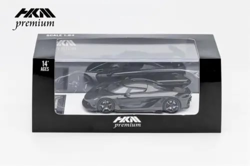 Black full carbon diecast model car in retail display box