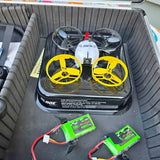 Blade Torrent 110 FPV quadcopter with yellow propellers and two green batteries