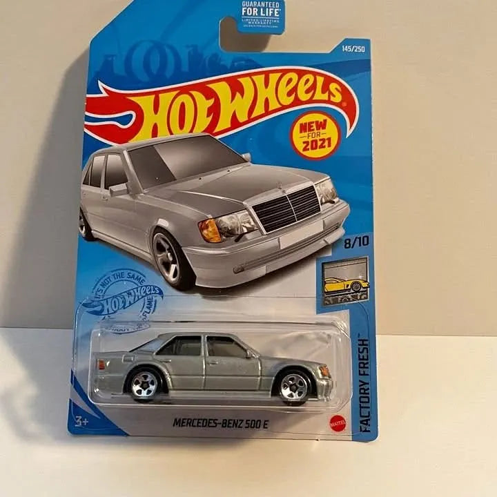 Hot Wheels die-cast grey sedan on blister card, front view