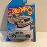 Hot Wheels die-cast grey sedan on blister card, front view