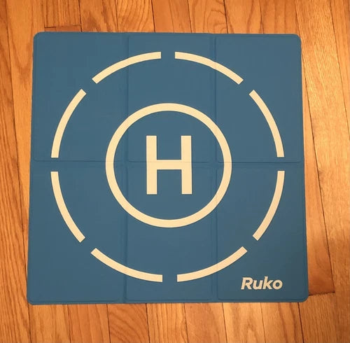 Drone landing pad mat, blue with white circular markings and H symbol, Ruko logo