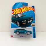 Teal Audi Quattro diecast car in Hot Wheels blister pack, front angle