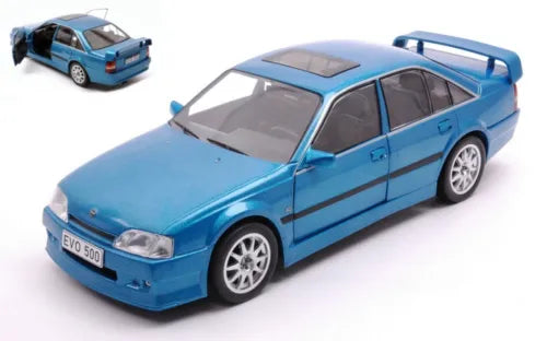 Blue 1:24 scale diecast sedan car with front-left three-quarter view
