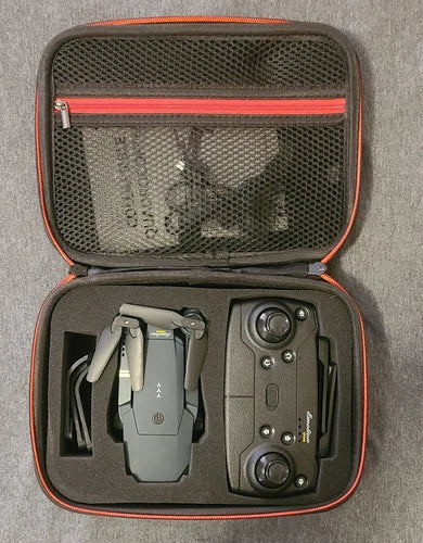 Hard-shell drone carrying case with quadcopter and controller, open