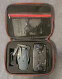 Hard-shell drone carrying case with quadcopter and controller, open