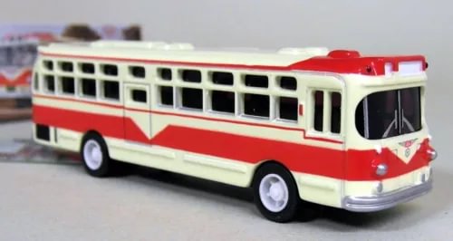 Red and cream diecast model bus with front grille detail and side windows
