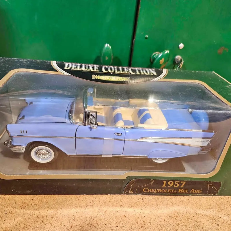 Light blue 1957 Chevrolet Bel Air convertible diecast model with open top