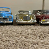 1/18 diecast car model, three front-facing cars with chrome bumpers