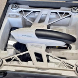 White quadcopter drone with black top and visible rotors in open protective case