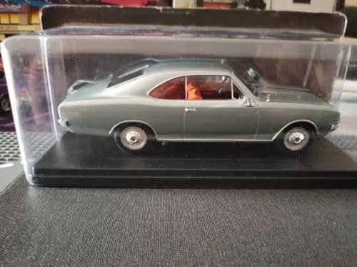 Classic die-cast model car, light gray, front side view
