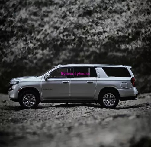 Silver diecast full-size SUV model toy with side doors and wheels, 1:64 scale