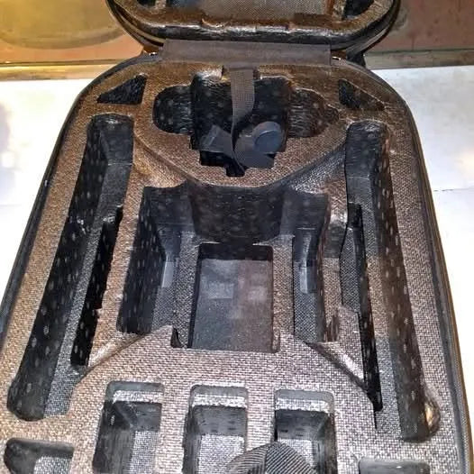 Drone backpack interior with molded foam compartments and straps