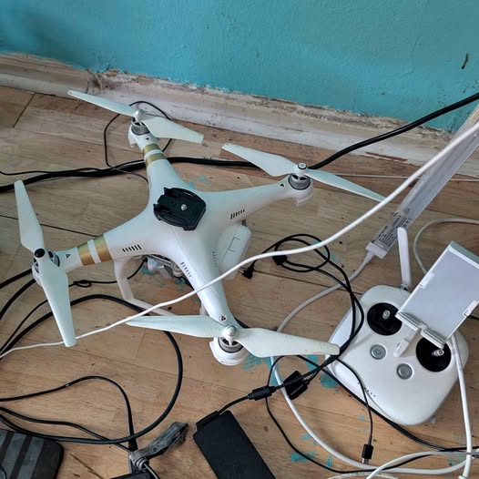White DJI Phantom 3 Pro drone with four propellers and camera gimbal