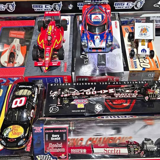 NASCAR diecast race car models in retail boxes, assorted designs