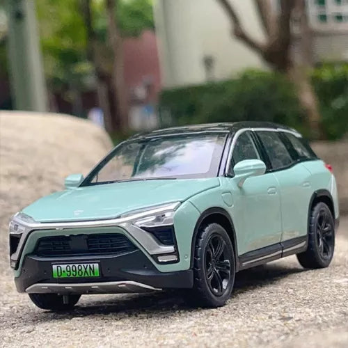 Mint green SUV diecast model car, front 3/4 view with open grille and headlights