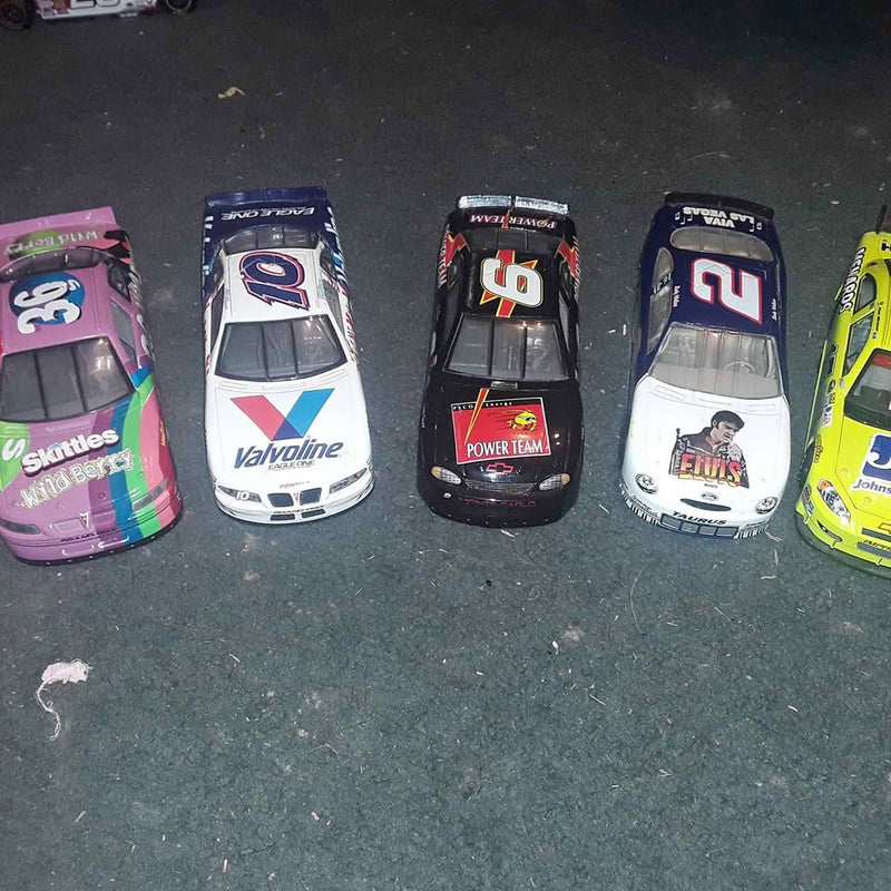 Set of five NASCAR 1:24 diecast collector cars in mixed colors