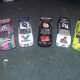 Set of five NASCAR 1:24 diecast collector cars in mixed colors