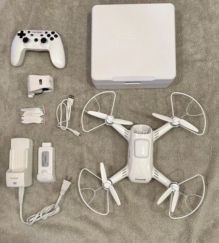 Yuneec Breeze drone kit with 4-prop quadcopter, controller, charger, and cables