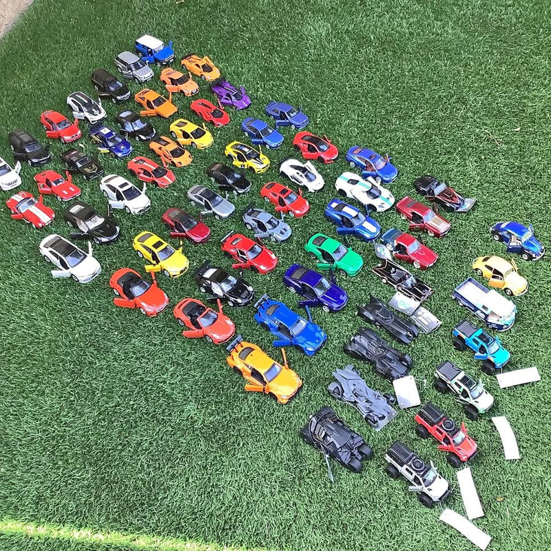 Assorted diecast model cars lot, 60 vehicles in mixed colors on display