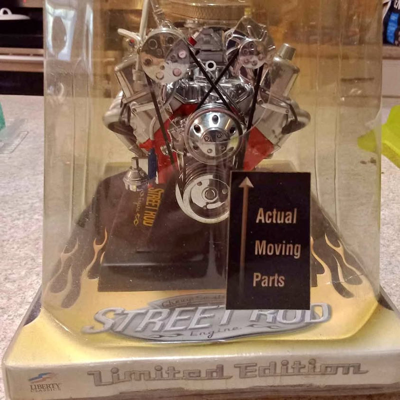 Diecast street rod V8 engine model in clear display box with flame graphics