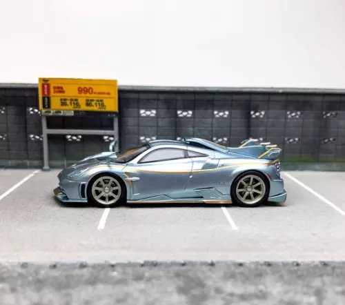 1:64 scale diecast sports car model, light blue gray, side view
