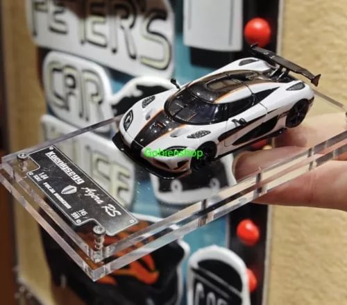 White and black Agera RS diecast sports car model in clear display case