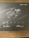 Gray 4K quadcopter drone with foldable arms, shown on product box top