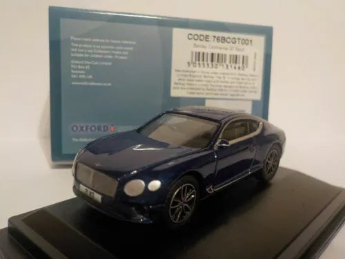 Dark blue diecast Bentley Continental GT Sport model car with front lights on display base