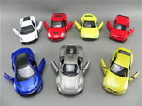 Diecast sports car toy lot with eight miniature cars in red, yellow, blue, white, and silver