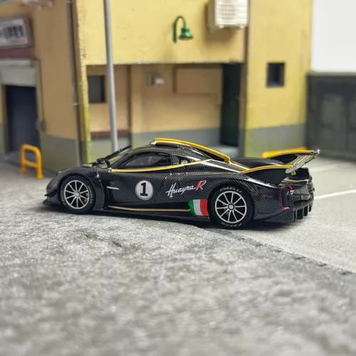 Carbon black diecast sports car model with number 1, front 3/4 view