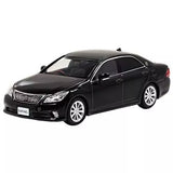 Black diecast sedan model car with silver wheels, front 3/4 view
