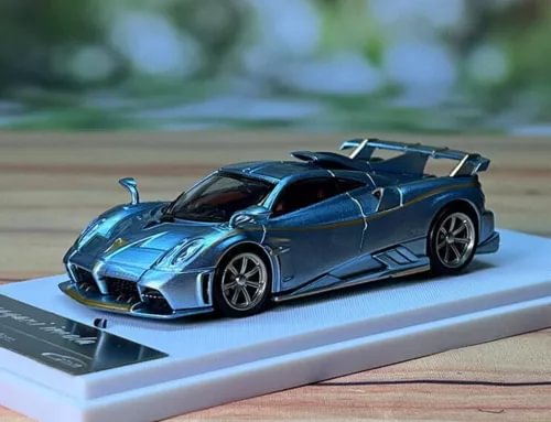 1/64 blue alloy diecast sports car model on display base, front three-quarter view