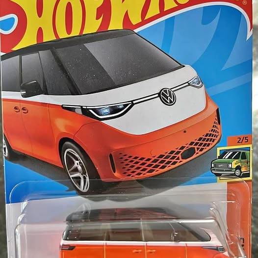 Orange diecast VW ID Buzz van with black roof and grille details, front view