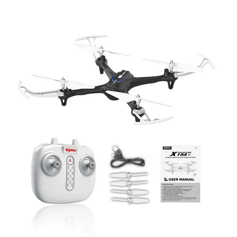 Small quadcopter drone with white controller, accessories, and instruction manual