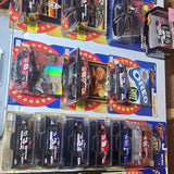 Assorted 1/43 NASCAR diecast cars in blister packs