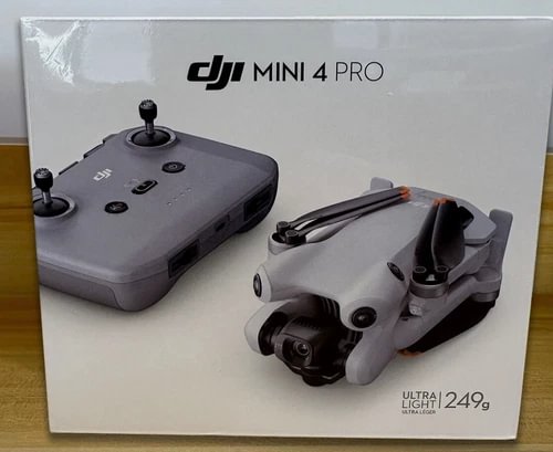 DJI Mini 4 Pro drone in retail box, with remote and camera module shown