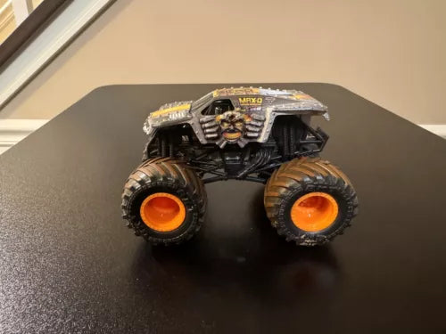 Hot Wheels Monster Jam 1:64 Max-D Parts diecast monster truck with orange wheels