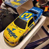Yellow and blue diecast race car with #3 hood and windshield decals