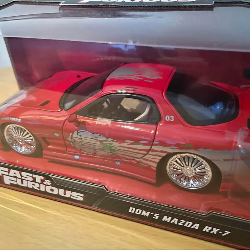 Red Mazda RX-7 1:24 diecast model car with chrome wheels and racing graphics