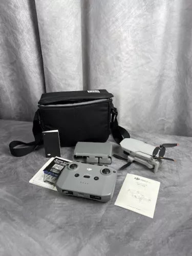 DJI Mini 2 SE vlogger drone combo kit with black carrying bag and controller