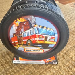 Hot Wheels 72 car case with circular illustrated wheel logo, black exterior