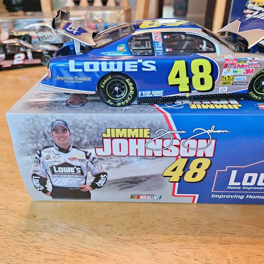 Blue diecast racing car with bold 48 number and Loue’s Jimmie Johnson decals