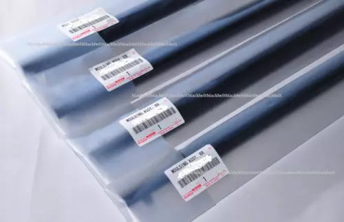 Silver diecast car body panel with four barcode stickers