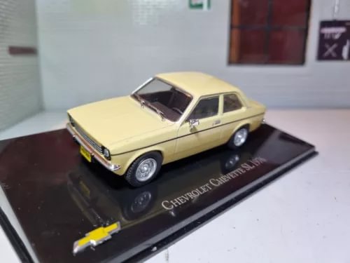 Cream 1:43 diecast classic car model, front three-quarter view