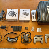 FPV goggles, FPV remote, and batteries from a drone fly more kit