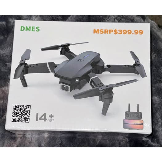 Retail box showing quadcopter drone with camera and remote controller with display