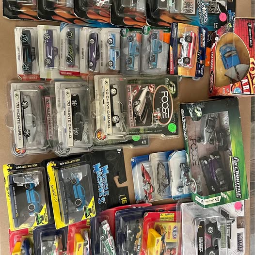 Diecast car toys in blister packs, assorted colors