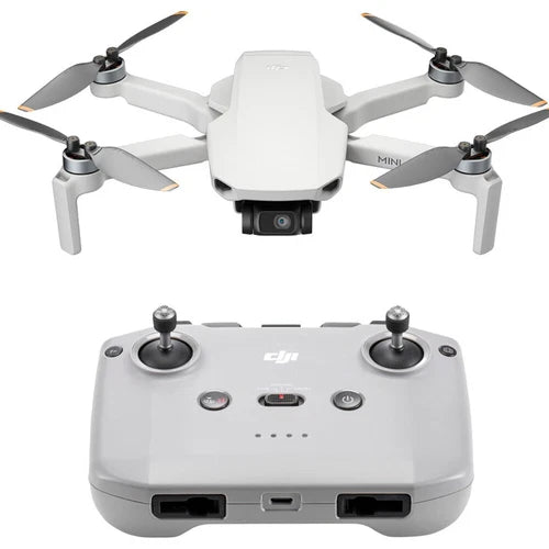 Gray quadcopter drone with camera and gray RC controller, four propeller arms