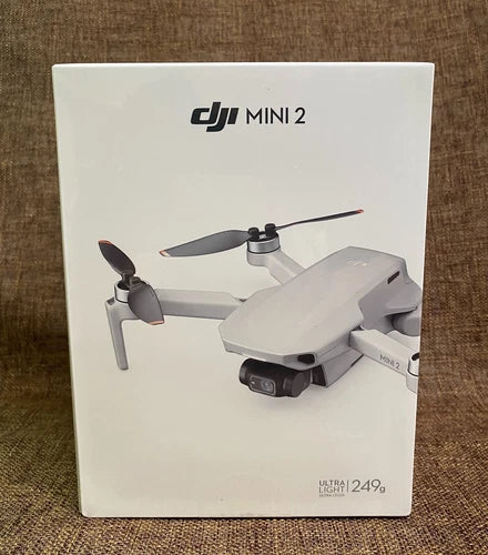 DJI Mini 2 drone box packaging with drone and propeller illustration